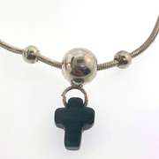 Sterling silver bracelet with three silver bead and a grey/black cross charm