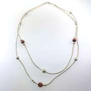 Sterling silver double strand necklace with orangish/brown and silver beads