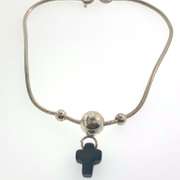Sterling silver bracelet with three silver bead and a grey/black cross charm