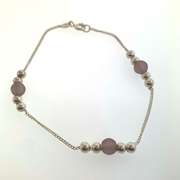 Sterling silver bracelet with purplish beads and silver beads