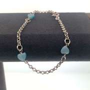Sterling silver bracelet with light blue heart charms