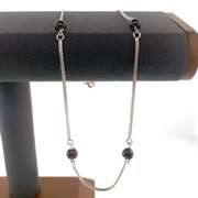 Sterling silver necklace with red beads.