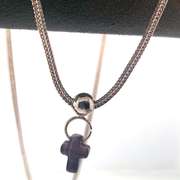 Sterling silver necklace with a purple cross charm and silver beads