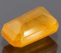 Vibrant 4.29ct emerald cut orange Sapphire