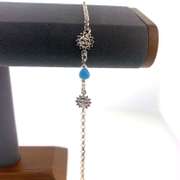 Sterling silver bracelet with light blue hearts and sun charms