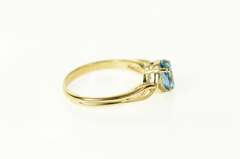 14K Yellow Gold Classic Oval Blue Topaz Solitaire Ring