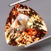 High fire 9.16ct trillion cut Imperial Topaz