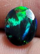Smoldering floral block flashing 1.53ct Welo black Opal