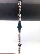 Sterling silver bracelet with silver beads and unique black charms