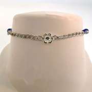 Sterling silver bracelet with blue beads and flower charm