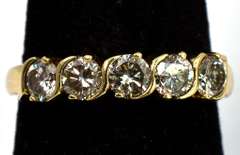 Dazzling 0.80CTW Diamond band in 14KT Yellow Gold