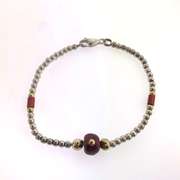 Sterling silver bracelet with red and silver beads