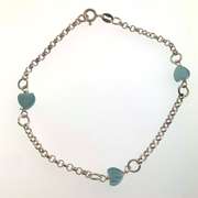Sterling silver bracelet with light blue heart charms