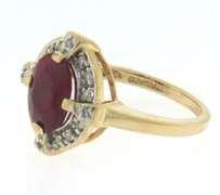 Handsome Oval Ruby and Diamond Halo Ring