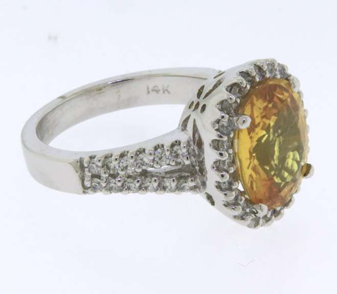 Remarkable White Gold oval Sapphire and Diamond Ring