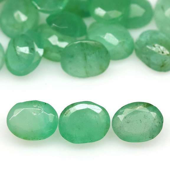 Oval cut 7.05ct Zambian Emerald set