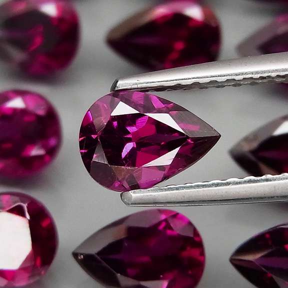 Amazing 9.54ct pear cut purple Garnet set