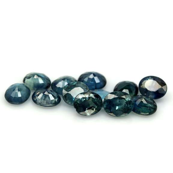 Heated only! 9.09ct blue green Sapphire set