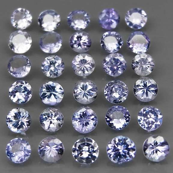 Heavy flashing 5.39ct diamond cut Tanzanite set