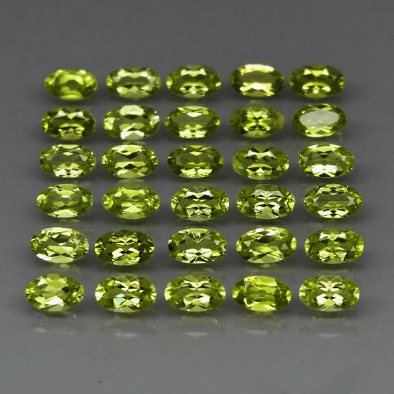 Dazzling 7.47ct untreated lime green Peridot set