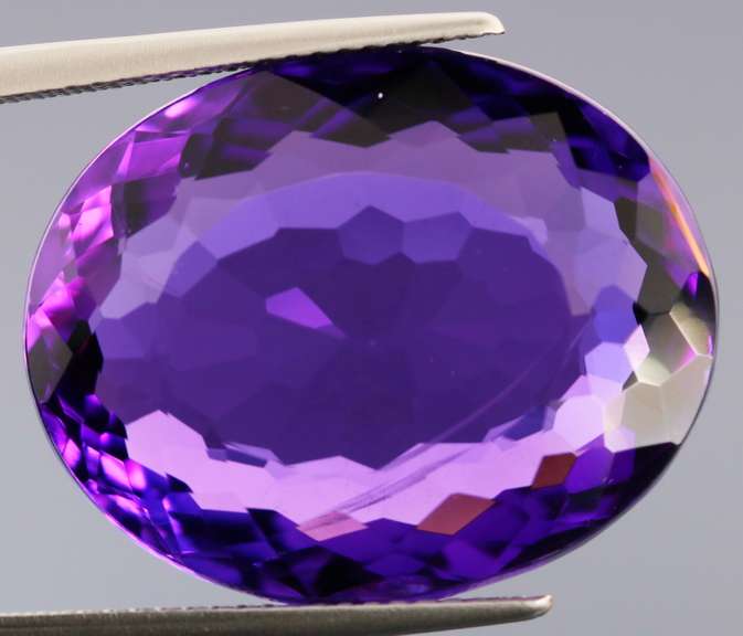 Oval cut 25.76ct royal purple created Amethyst