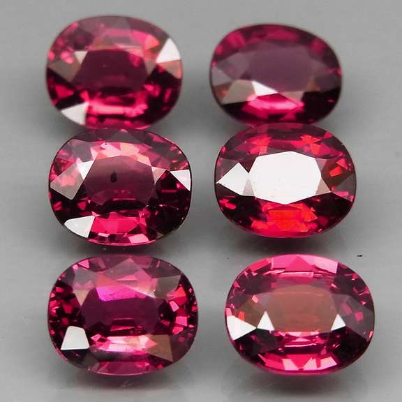 Amazing 6.61ct oval cut violet pink Garnet set