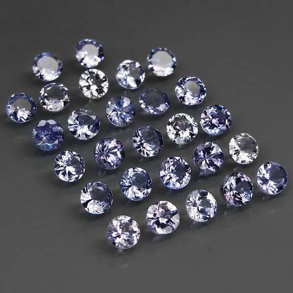 Heavy flashing 5.58ct diamond cut Tanzanite set