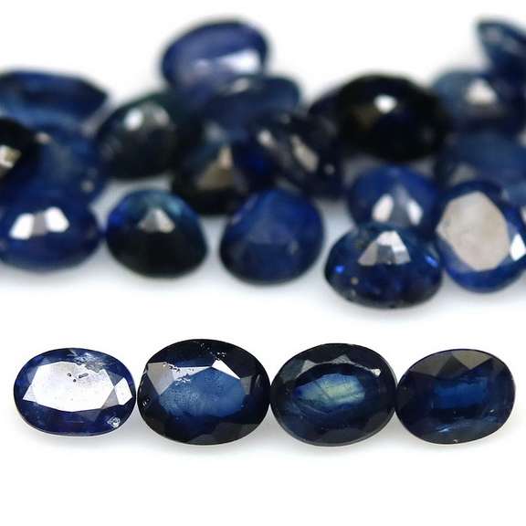 Stunning ink blue 8.64ct oval Sapphire set