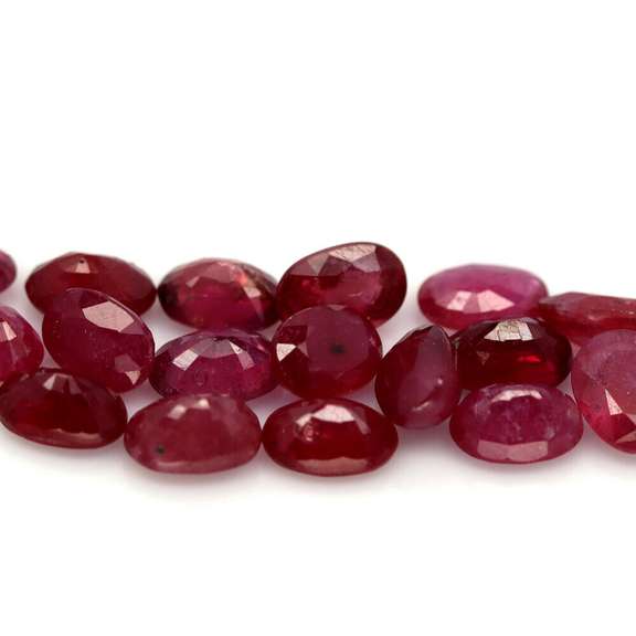 Vibrant 12.75ct oval cut imperial red Ruby set