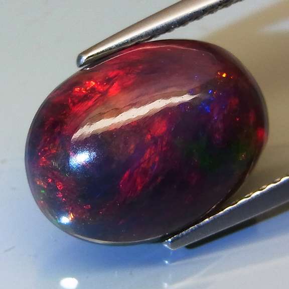 Smoldering flashing 2.98ct Welo Black Opal