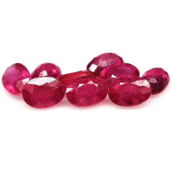 Vibrant 10.88ct oval cut reddish pink Ruby set
