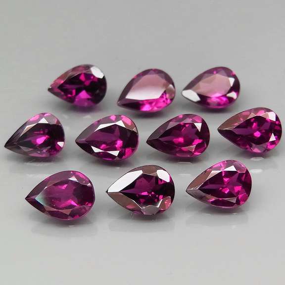 Premium pear cut 8.28ct VS Rhodolite Garnet set