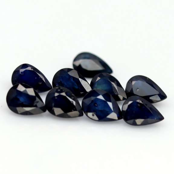 Stunning ink blue 7.34ct pear Sapphire set