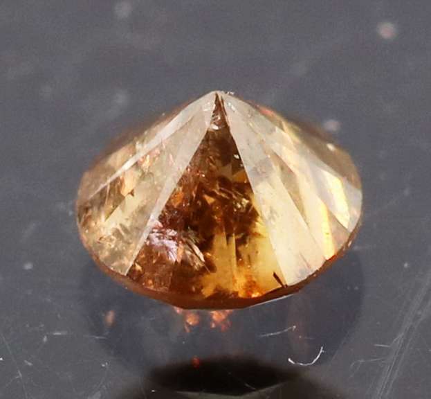 Eye catching 0.22ct smooth cut red Diamond solitaire