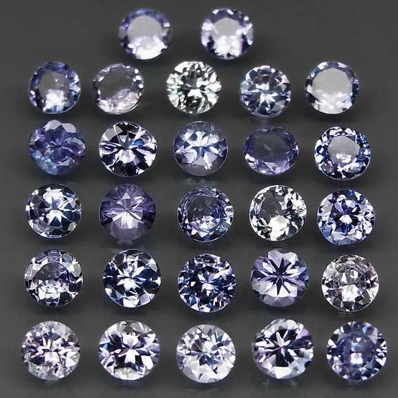 Heavy flashing 5.58ct diamond cut Tanzanite set