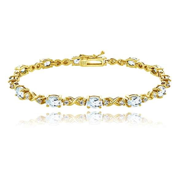 Yellow Gold Flashed Sterling Silver Blue Topaz 6x4mm Oval Infinity Bracelet with White Topaz Accents
