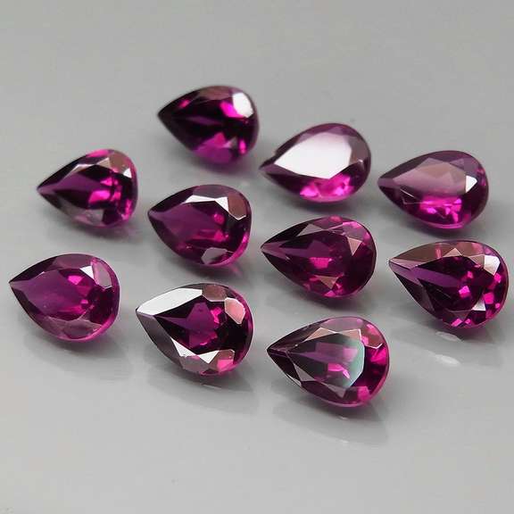 Premium pear cut 8.28ct VS Rhodolite Garnet set