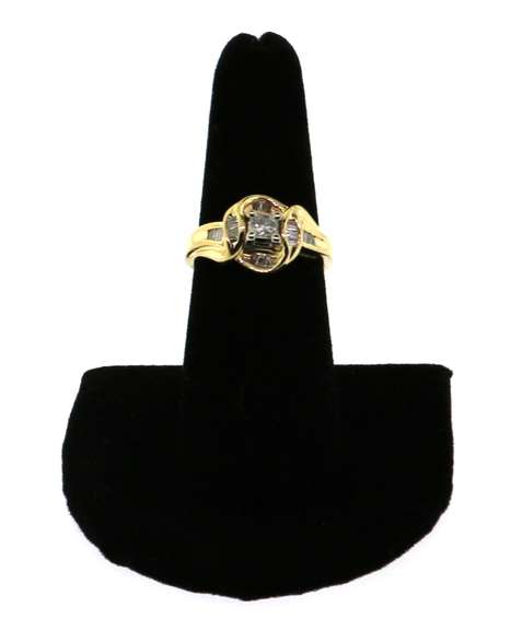 Impeccable Square Diamond Ring surrounded by Baguette Diamonds on a 14k Gold Band