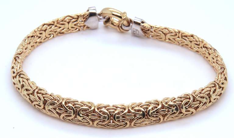 Dynamic Yellow Gold Byzantine Bracelet with Diamond accents
