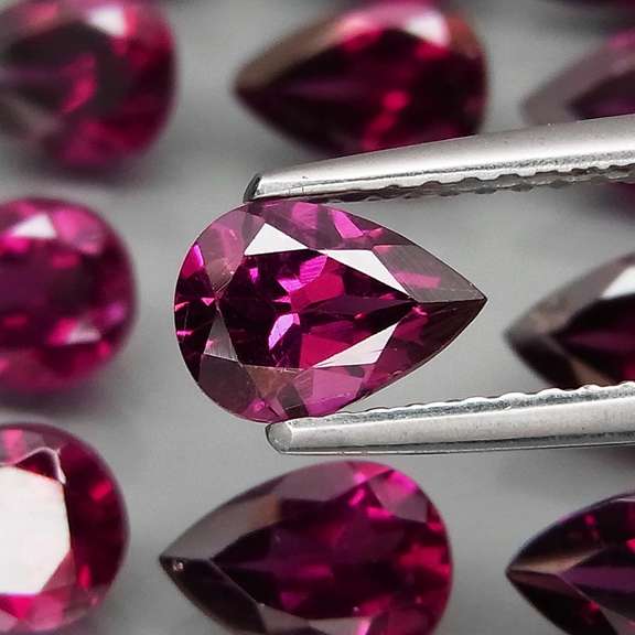 Premium pear cut 10.64ct VS Rhodolite Garnet set