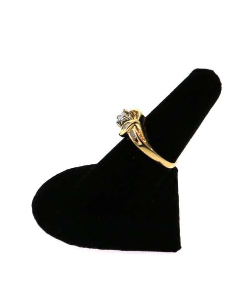 Impeccable Square Diamond Ring surrounded by Baguette Diamonds on a 14k Gold Band