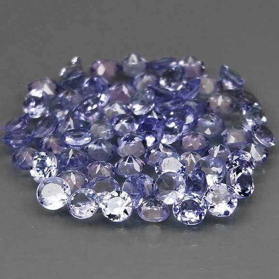 Heavy flashing 4.79ct diamond cut Tanzanite set