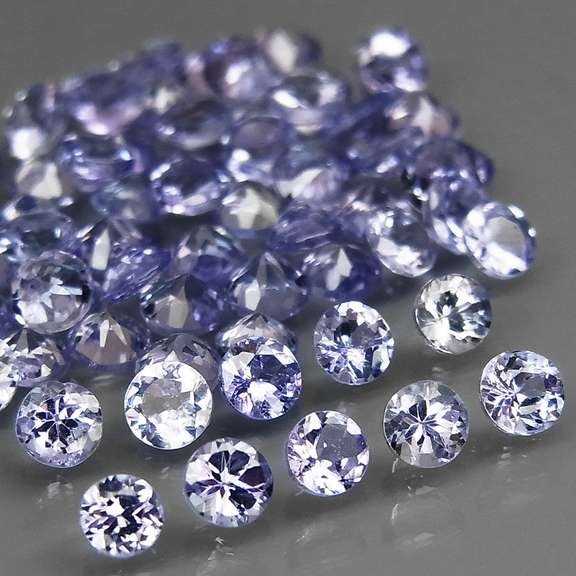 Heavy flashing 4.79ct diamond cut Tanzanite set