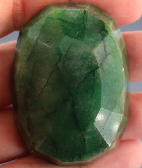 Heavy 329ct oval cut forest green Emerald