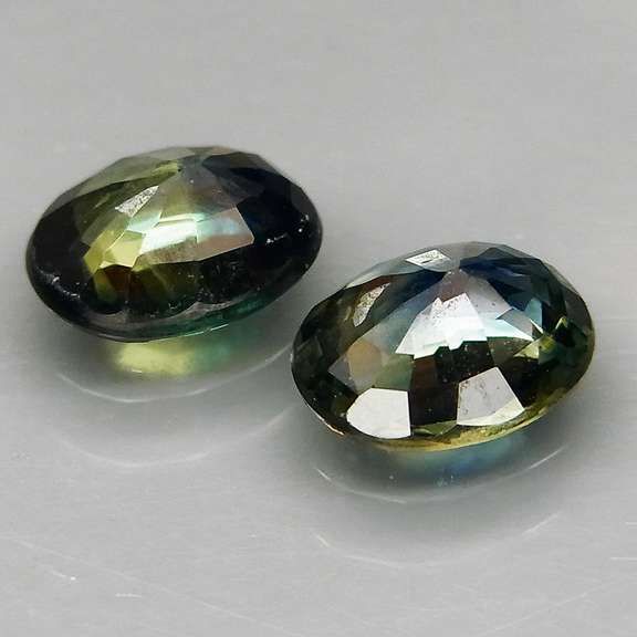 Excellent 1.49ct matched pair of blue green Sapphires