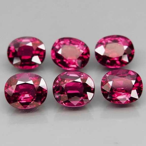 Amazing 7.32ct oval cut violet red Garnet set