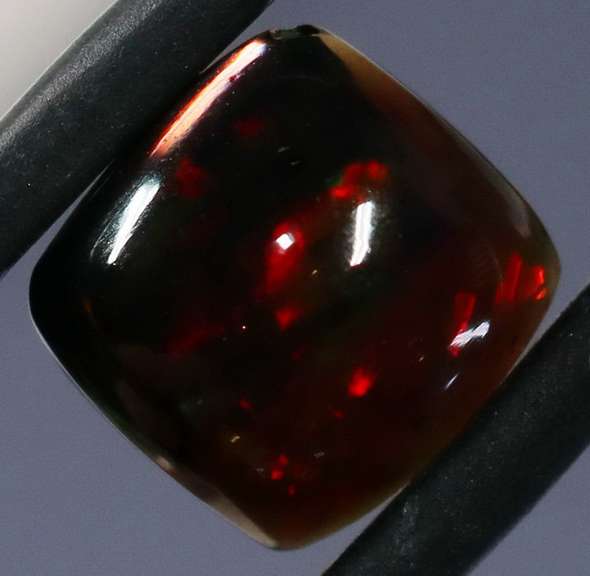 Magnificent 1.74ct pinfire flashing Black Opal