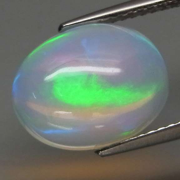 Glowing! 3.07ct rolling floral pattern Jelly Opal