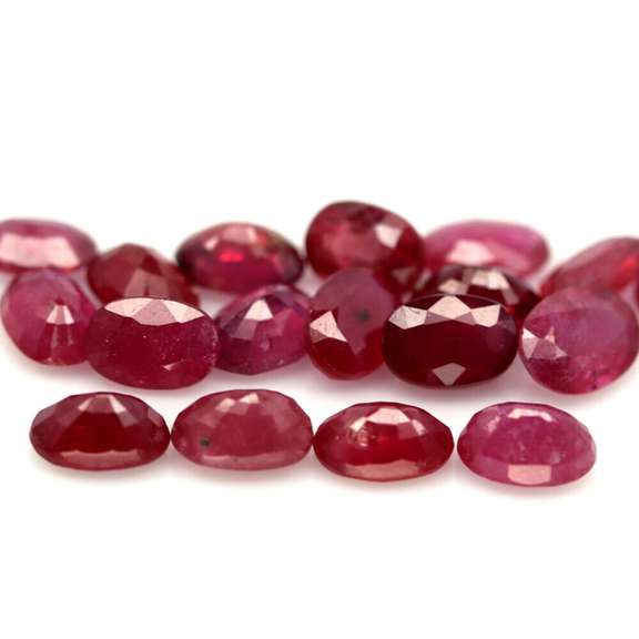 Vibrant 12.75ct oval cut imperial red Ruby set