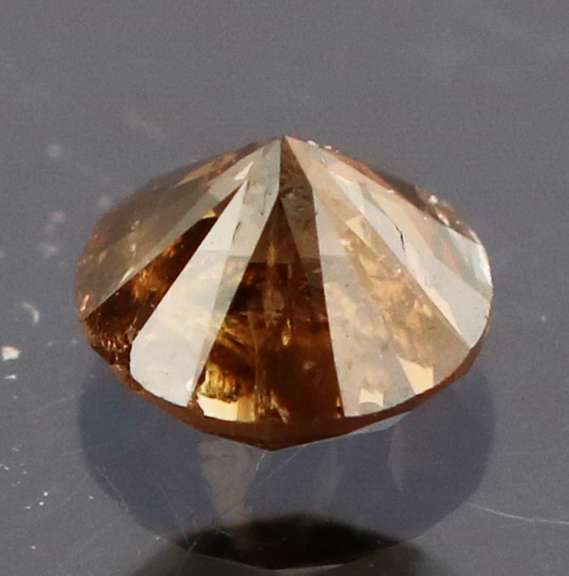 Eye catching 0.22ct smooth cut red Diamond solitaire